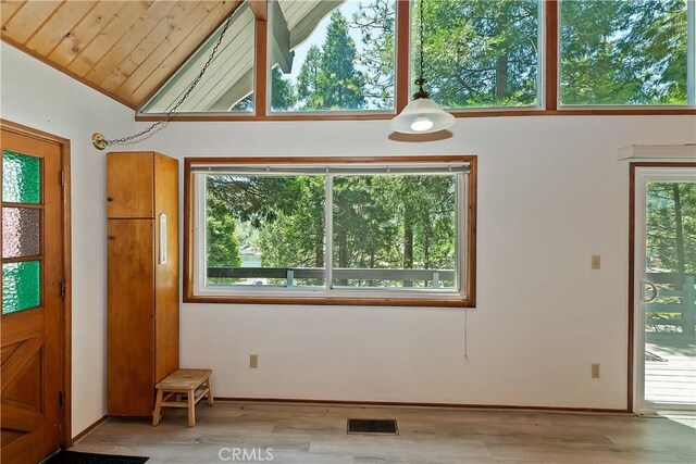 24141 Zell Ct, Crestline, CA 92325 - entrance foyer featuring wood finished floors, vaulted ceiling, and baseboards