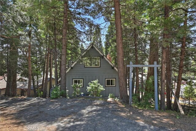 24141 Zell Ct, Crestline, CA 92325 - view of side of home with a chimney