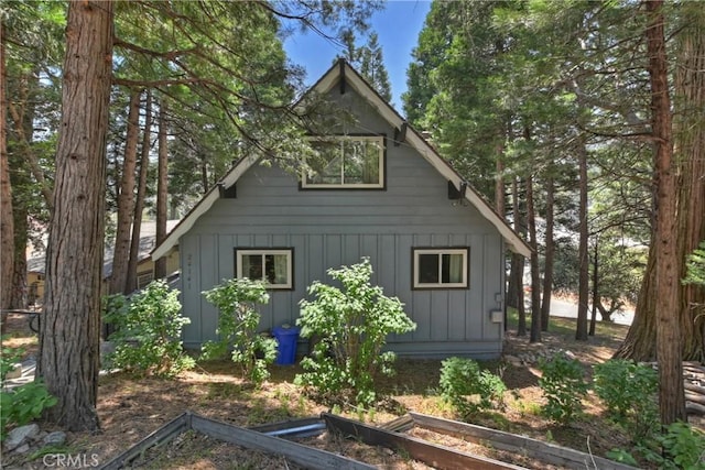 24141 Zell Ct, Crestline, CA 92325 - view of property exterior featuring a garden and board and batten siding