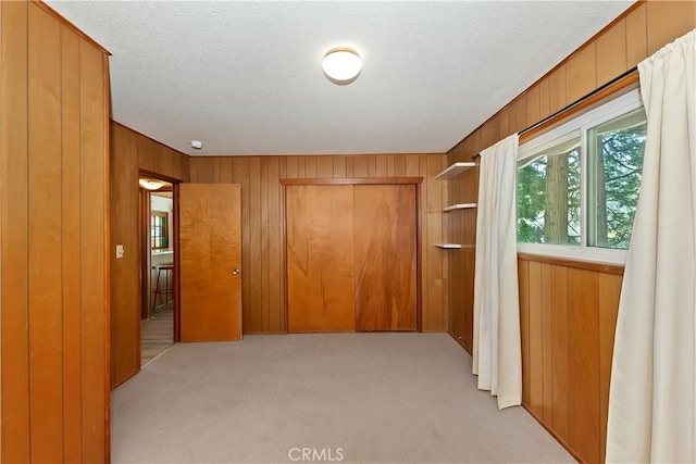24141 Zell Ct, Crestline, CA 92325 - hall with wood walls and light colored carpet