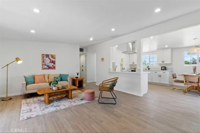 7686 Deer Trl, Yucca Valley, CA 92284 - living room featuring light wood-style flooring, recessed lighting, and baseboards