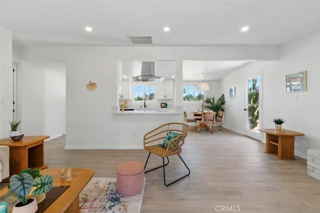 7686 Deer Trl, Yucca Valley, CA 92284 - living room featuring light wood-type flooring, recessed lighting, and baseboards