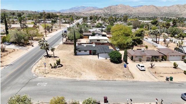 7686 Deer Trl, Yucca Valley, CA 92284 - aerial perspective of suburban area featuring a mountain backdrop