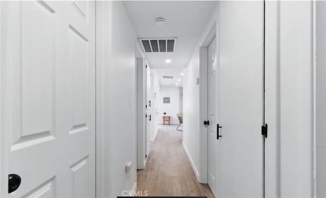 7686 Deer Trl, Yucca Valley, CA 92284 - corridor featuring light wood-style floors and baseboards