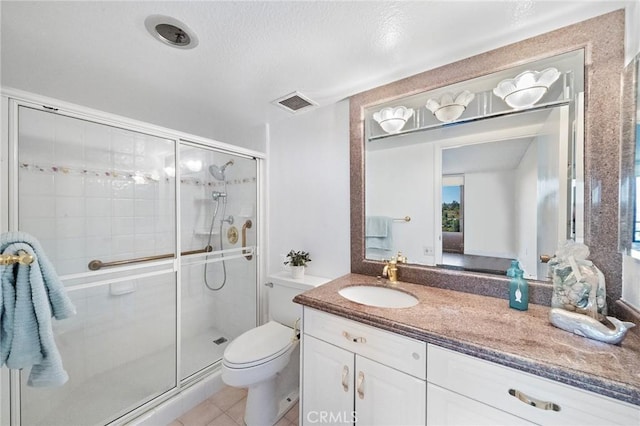24055 Paseo Del Lago Unit 1206, Laguna Woods, CA 92637 - full bathroom featuring toilet, vanity, a shower stall, and tile patterned flooring