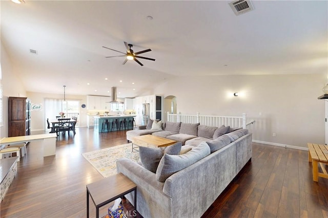 200 Cyclone St, Nipomo, CA 93444 - living area featuring a ceiling fan, vaulted ceiling, arched walkways, dark wood-style floors, and baseboards