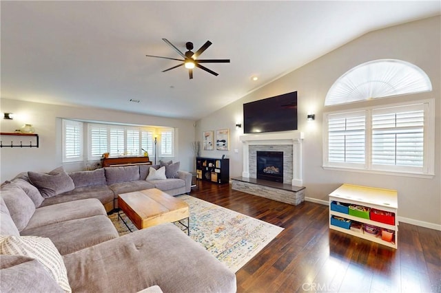 200 Cyclone St, Nipomo, CA 93444 - living area featuring a ceiling fan, lofted ceiling, dark wood-type flooring, baseboards, and a stone fireplace