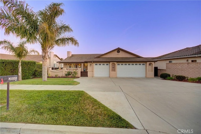 200 Cyclone St, Nipomo, CA 93444 - ranch-style home with an attached garage, driveway, and stucco siding