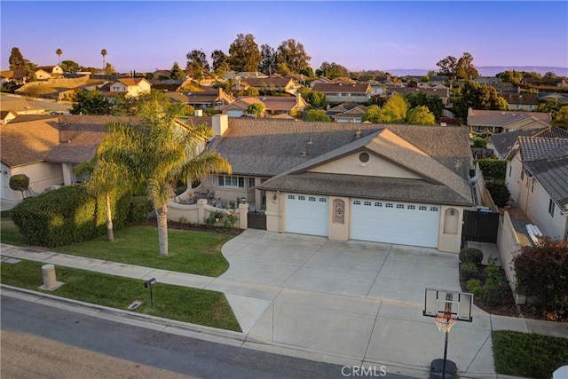 200 Cyclone St, Nipomo, CA 93444 - view of front of home featuring an attached garage, a residential view, concrete driveway, and stucco siding