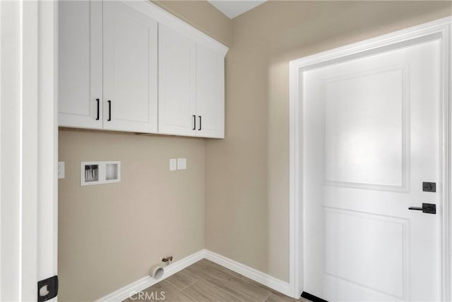 6693 Banyan Ave, Hesperia, CA 92345 - laundry area with hookup for a washing machine, baseboards, and cabinet space