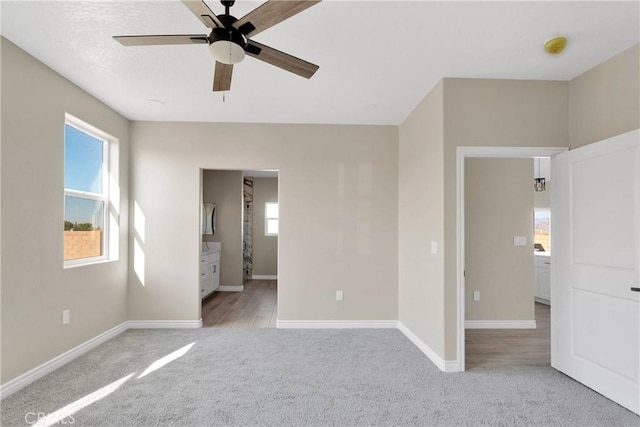6693 Banyan Ave, Hesperia, CA 92345 - empty room with light colored carpet, a ceiling fan, and baseboards