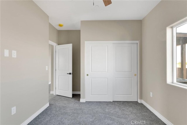 6693 Banyan Ave, Hesperia, CA 92345 - unfurnished bedroom featuring carpet, baseboards, a closet, and a ceiling fan