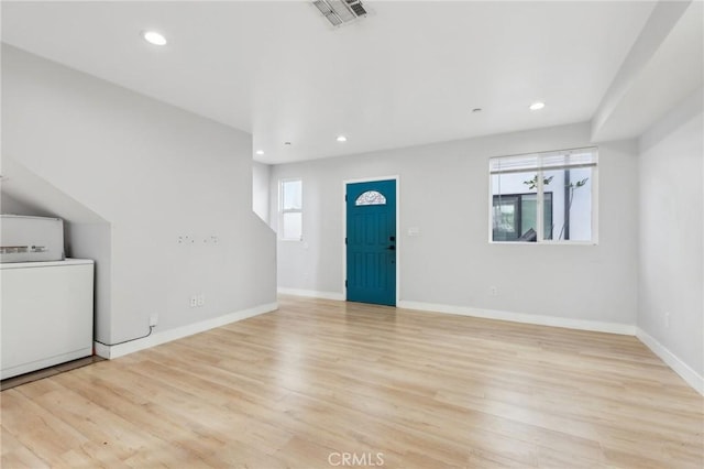2806 Cudahy St, Huntington Park, CA 90255 - foyer with washer / dryer, wood finished floors, recessed lighting, and baseboards