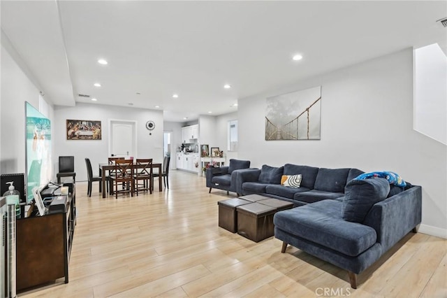 2806 Cudahy St, Huntington Park, CA 90255 - living area featuring light wood-style flooring, recessed lighting, and healthy amount of natural light