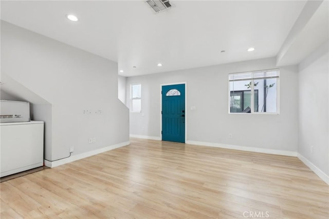 2806 Cudahy St, Huntington Park, CA 90255 - entryway featuring washer / clothes dryer, light wood finished floors, recessed lighting, and baseboards