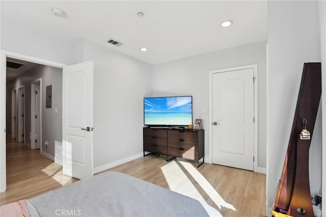 2806 Cudahy St, Huntington Park, CA 90255 - bedroom with light wood-style flooring, baseboards, recessed lighting, and electric panel