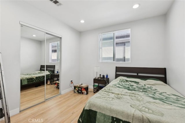 2806 Cudahy St, Huntington Park, CA 90255 - bedroom featuring wood finished floors, recessed lighting, a closet, and baseboards