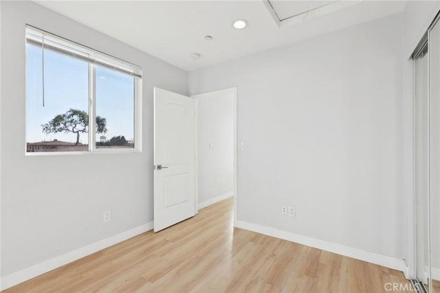 2806 Cudahy St, Huntington Park, CA 90255 - spare room with wood finished floors, baseboards, and recessed lighting