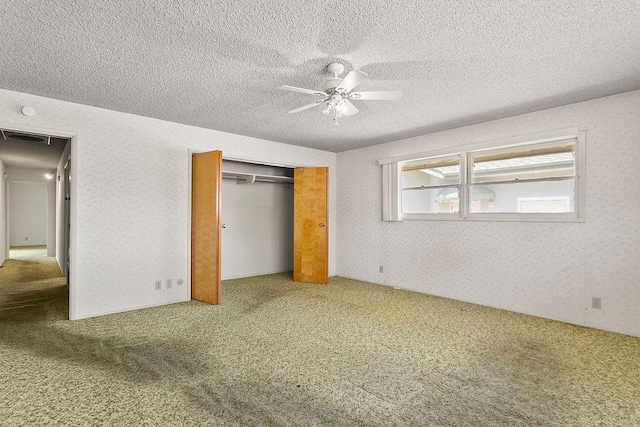 13321 Prospect Ave, North Tustin, CA 92705 - unfurnished bedroom featuring carpet flooring, a closet, wallpapered walls, a textured ceiling, and ceiling fan