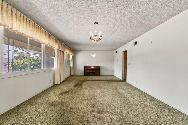 13321 Prospect Ave, North Tustin, CA 92705 - empty room featuring a chandelier, carpet floors, and a textured ceiling