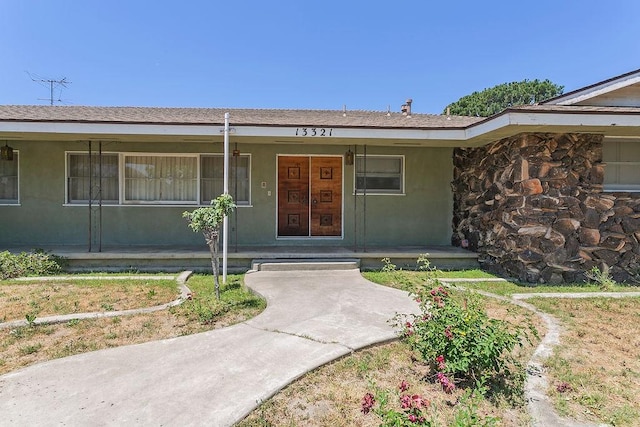 13321 Prospect Ave, North Tustin, CA 92705 - doorway to property featuring covered porch and stucco siding
