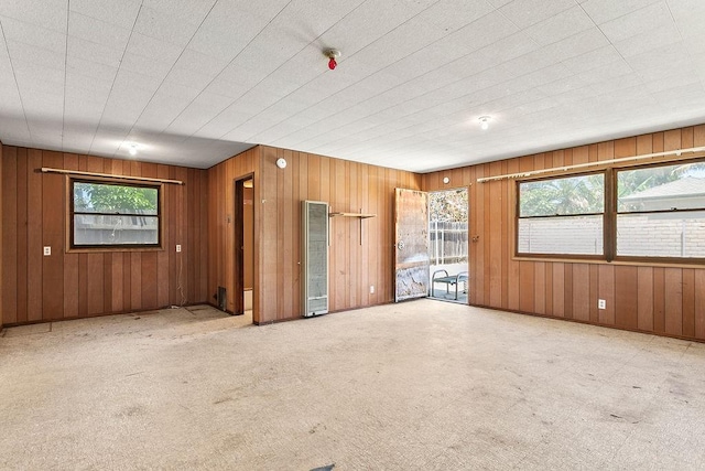 13321 Prospect Ave, North Tustin, CA 92705 - carpeted spare room with a heating unit and wooden walls