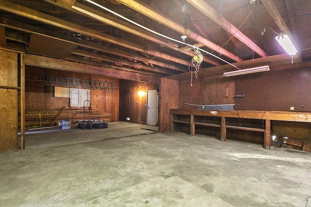 13321 Prospect Ave, North Tustin, CA 92705 - misc room with unfinished concrete floors and a workshop area