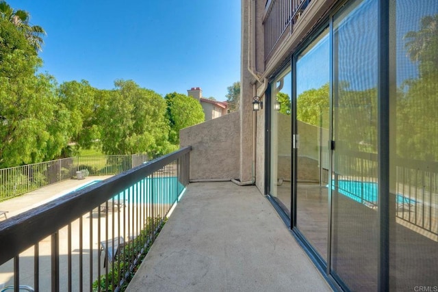 2564 Navarra Dr Unit 115, Carlsbad, CA 92009 - balcony featuring view of pool area
