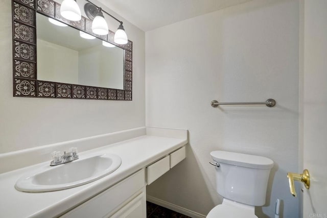 2564 Navarra Dr Unit 115, Carlsbad, CA 92009 - bathroom with toilet, vanity, and baseboards