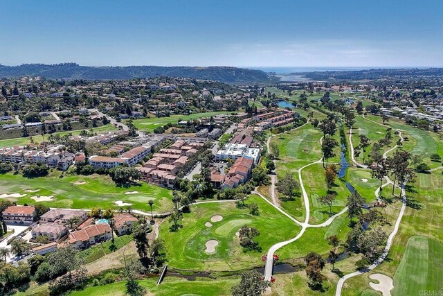 2564 Navarra Dr Unit 115, Carlsbad, CA 92009 - aerial view of property and surrounding area featuring nearby suburban area, a golf club, and a water and mountain view