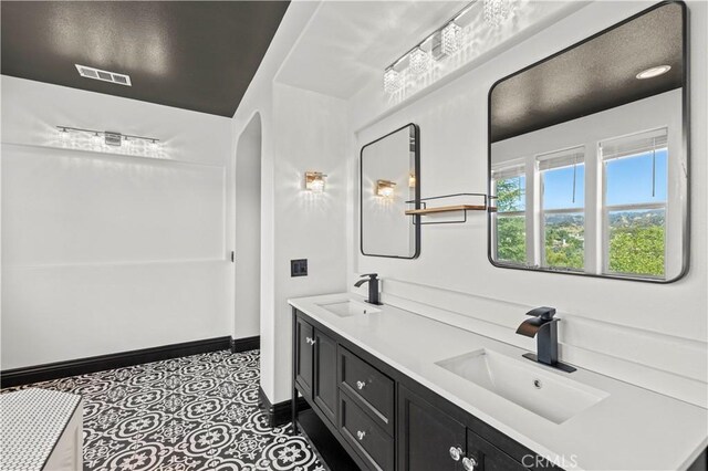 26556 Beecher Ln, Stevenson Ranch, CA 91381 - bathroom with double vanity and baseboards