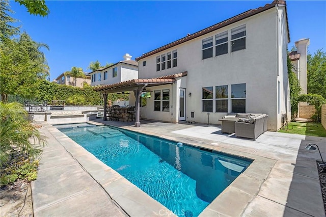 26556 Beecher Ln, Stevenson Ranch, CA 91381 - rear view of property with an outdoor living space, a pergola, stucco siding, a tile roof, and a patio