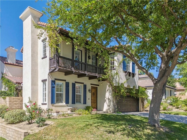 26556 Beecher Ln, Stevenson Ranch, CA 91381 - view of front of home featuring a balcony, stucco siding, a front yard, and a garage