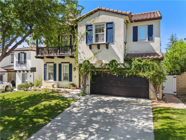 26556 Beecher Ln, Stevenson Ranch, CA 91381 - mediterranean / spanish-style house with a garage, a tiled roof, stucco siding, a balcony, and driveway