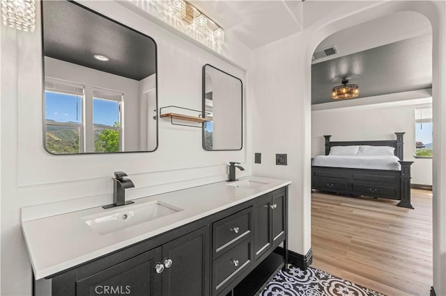 26556 Beecher Ln, Stevenson Ranch, CA 91381 - full bathroom featuring wood finished floors and double vanity