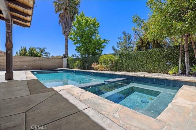 26556 Beecher Ln, Stevenson Ranch, CA 91381 - view of swimming pool featuring a fenced backyard, a pool with connected hot tub, and a patio area