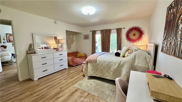 11467 Tampa Ave Unit 154, Porter Ranch, CA 91326 - bedroom with light wood-type flooring