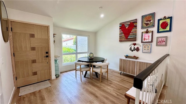 11467 Tampa Ave Unit 154, Porter Ranch, CA 91326 - dining area featuring vaulted ceiling, light wood-style floors, baseboards, and recessed lighting