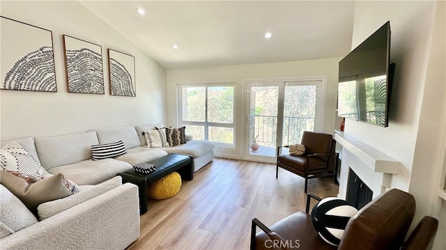 11467 Tampa Ave Unit 154, Porter Ranch, CA 91326 - living area with vaulted ceiling, light wood finished floors, and recessed lighting