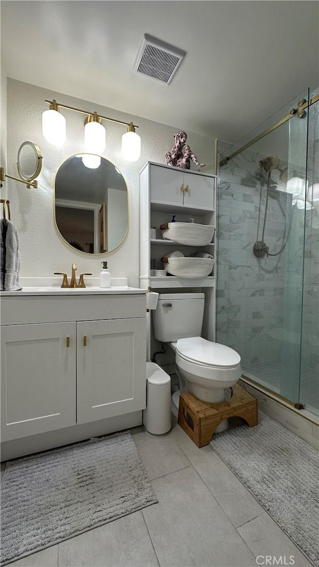 11467 Tampa Ave Unit 154, Porter Ranch, CA 91326 - full bath with a stall shower, vanity, toilet, and tile patterned flooring
