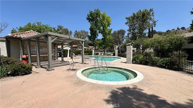 11467 Tampa Ave Unit 154, Porter Ranch, CA 91326 - community pool featuring a patio and a hot tub