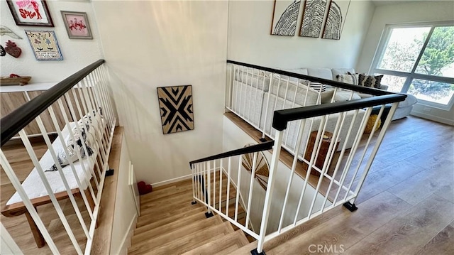 11467 Tampa Ave Unit 154, Porter Ranch, CA 91326 - stairway featuring wood finished floors and baseboards