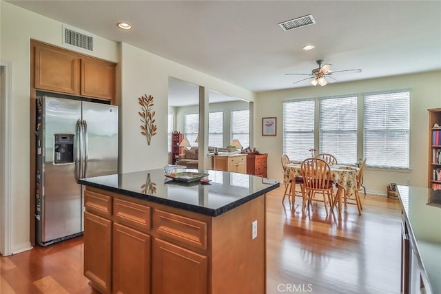 3607 Cascara Ct, Simi Valley, CA 93065 - kitchen with stainless steel fridge with ice dispenser, wood finished floors, a ceiling fan, a kitchen island, and recessed lighting