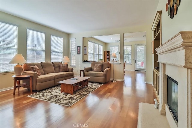 3607 Cascara Ct, Simi Valley, CA 93065 - living area with light wood-type flooring, a fireplace, and baseboards