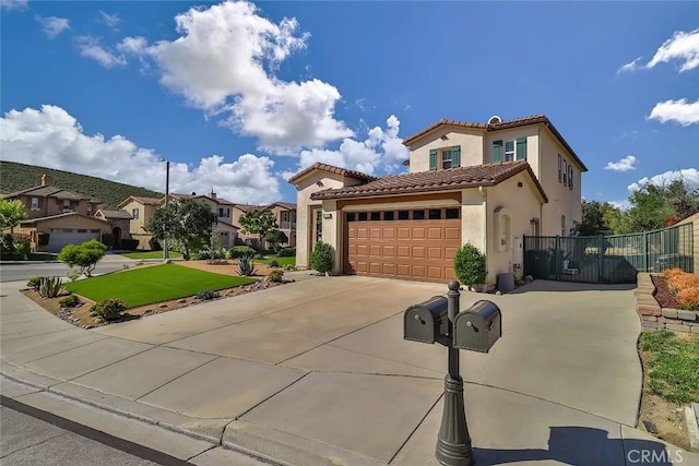 3607 Cascara Ct, Simi Valley, CA 93065 - mediterranean / spanish-style house with a tiled roof, an attached garage, driveway, stucco siding, and a residential view
