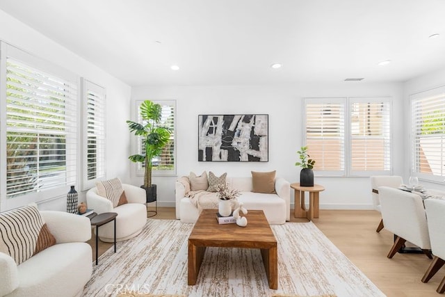 61 Jade Flower, Irvine, CA 92620 - living area with light wood-style floors, baseboards, and recessed lighting