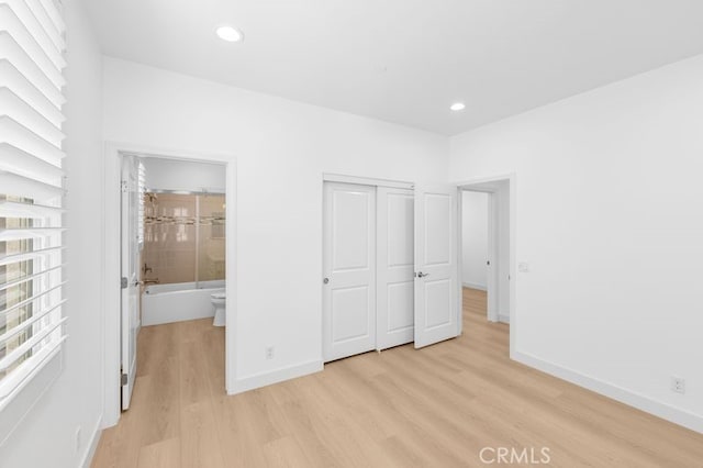 61 Jade Flower, Irvine, CA 92620 - unfurnished bedroom featuring light wood-style flooring, baseboards, a closet, recessed lighting, and ensuite bathroom