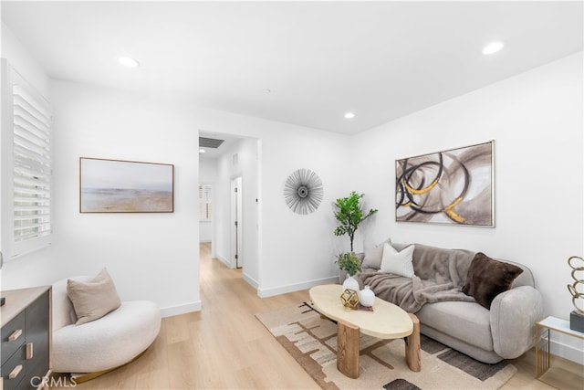 61 Jade Flower, Irvine, CA 92620 - living area featuring light wood-style floors, recessed lighting, and baseboards