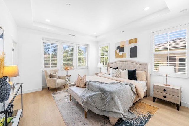 61 Jade Flower, Irvine, CA 92620 - bedroom featuring a tray ceiling, light wood-style flooring, recessed lighting, and baseboards