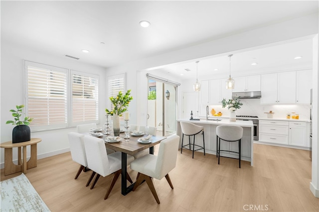 61 Jade Flower, Irvine, CA 92620 - dining area with light wood finished floors, recessed lighting, and baseboards